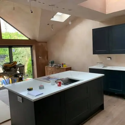 Kitchen cabinetry being installed during a TJC whole-home refurbishment